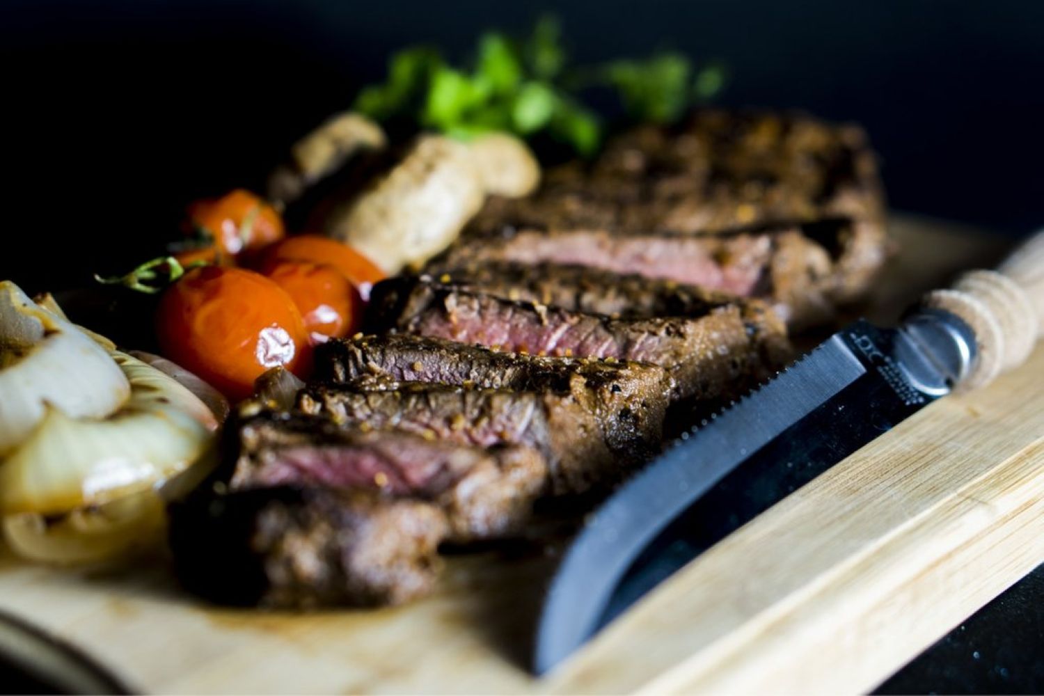 Cut steak and garnish on a chopping board